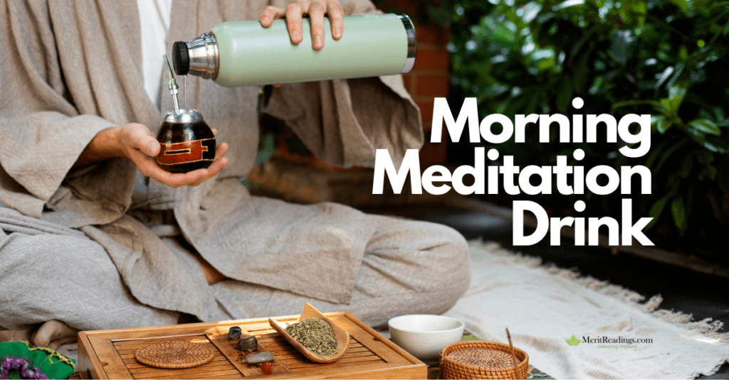 A person in a beige robe sits cross-legged on the floor, pouring a hot beverage from a green thermos into a traditional mate cup with a metal straw. A wooden tea tray with herbs, stones, and a woven coaster is in front of them. The background features green plants, creating a peaceful meditation setting. The words "Morning Meditation Drink" are displayed in bold white text, with the "MeritReadings.com" logo in the bottom right corner.